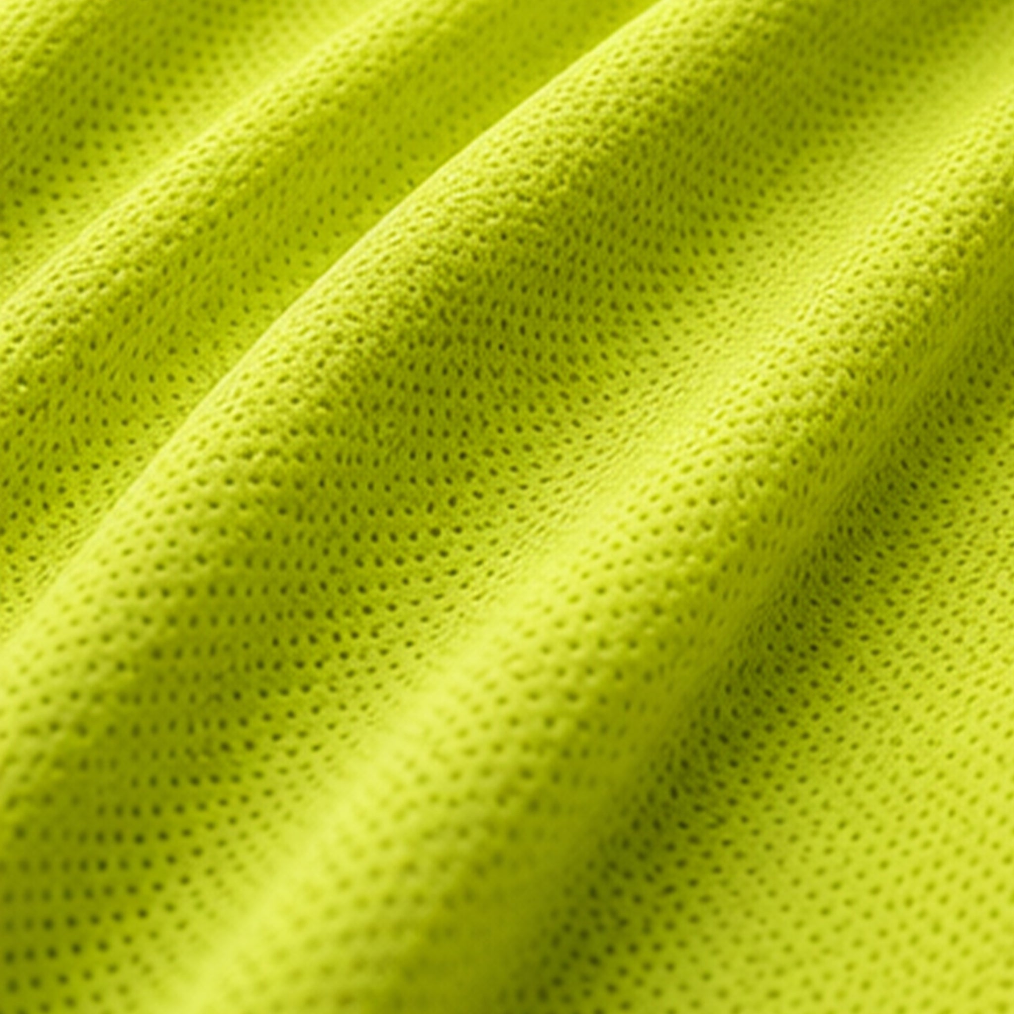 Close-up of the lightweight, breathable high-visibility yellow HELIO fabric.