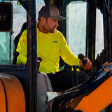 Man in a hi-vis yellow GOBI Helio UPF Sun Hoodie and trucker cap operating a forklift on a job site.